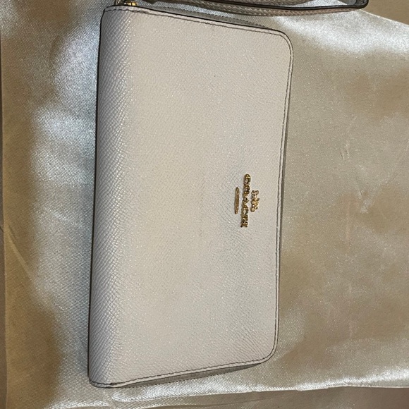 Coach Handbags - Coach Gold-Logo Pebbled Leather Wristlet in cream color